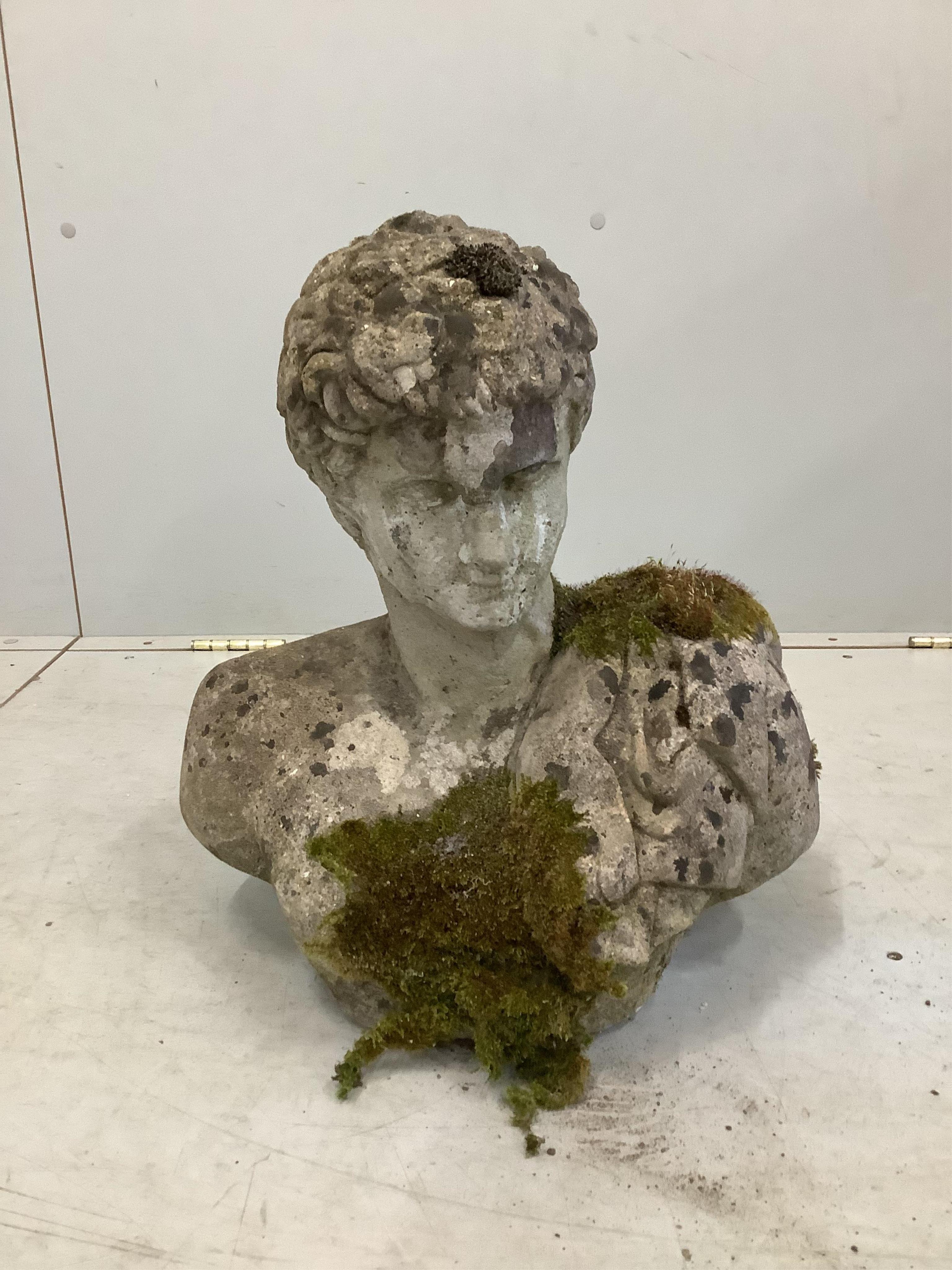 A weathered reconstituted stone garden ornament, height 42cm. Condition - fair